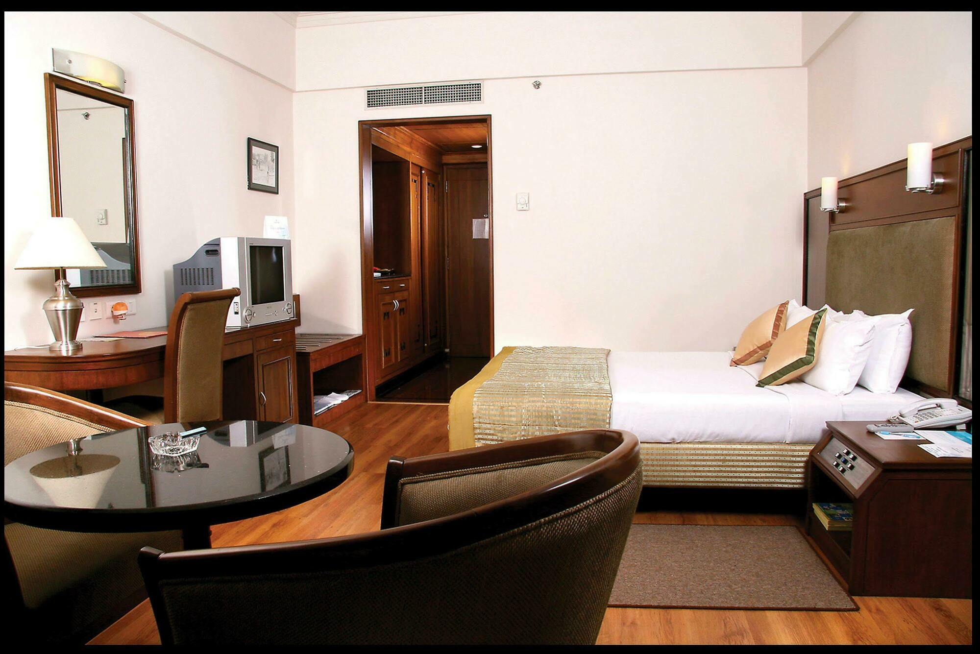 Greenpark Csennai Szoba fotó A room at the hotel
